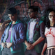 Four people stand against a wall in Saints Row, one of the delayed video games in 2022.